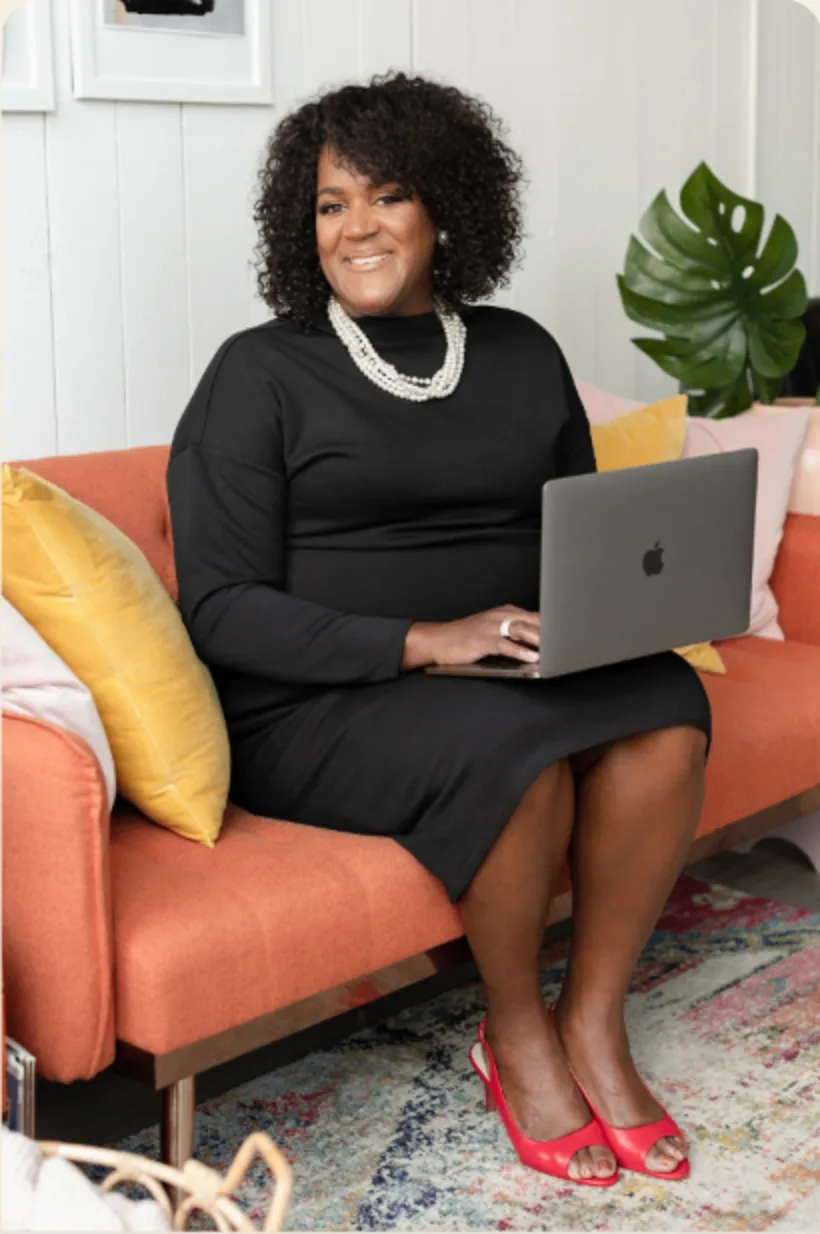 Dr. Keisha Scarlett working with a laptop