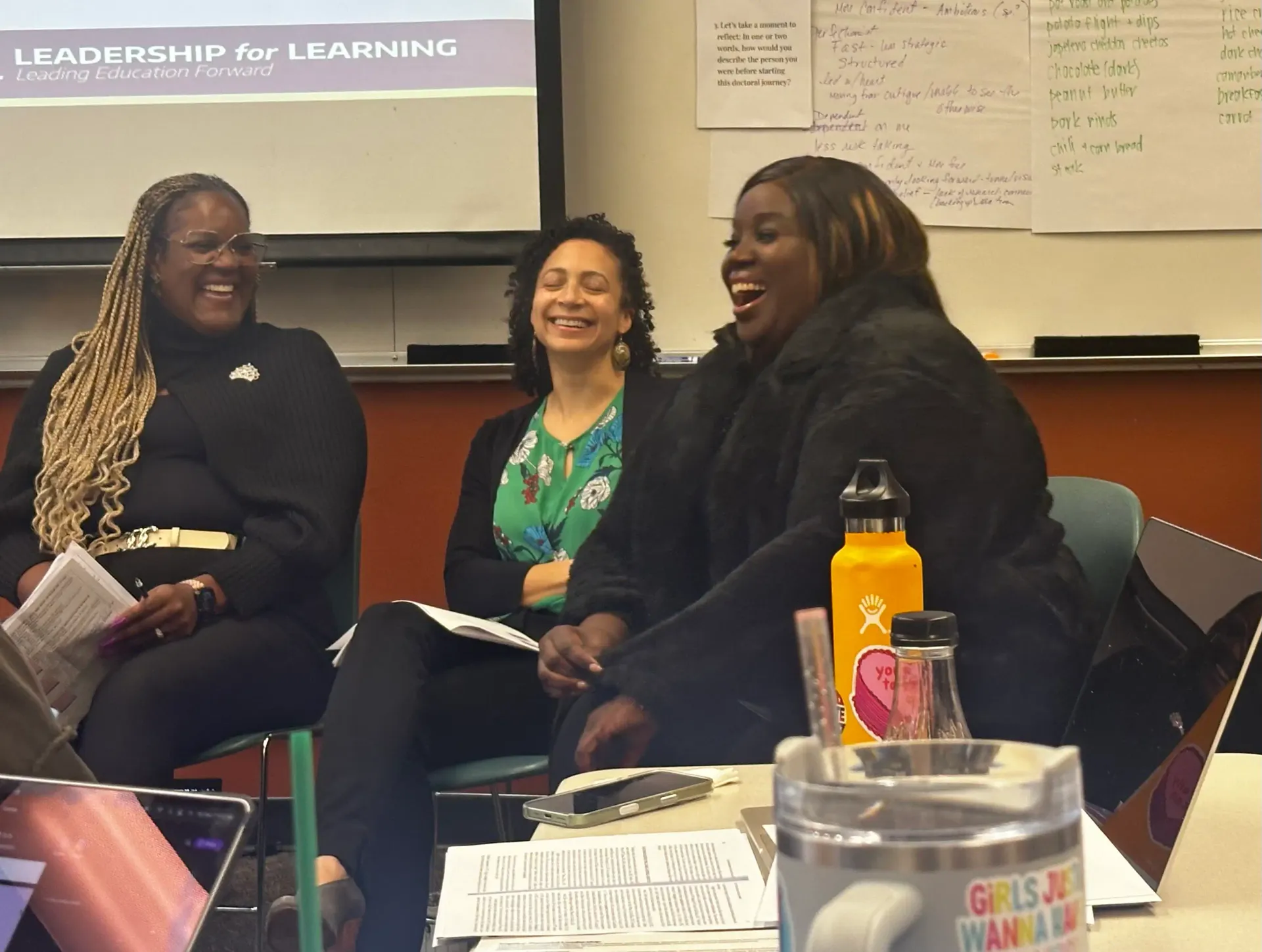 Dr. Keisha Scarlett collaborating with two colleagues in a workshop setting